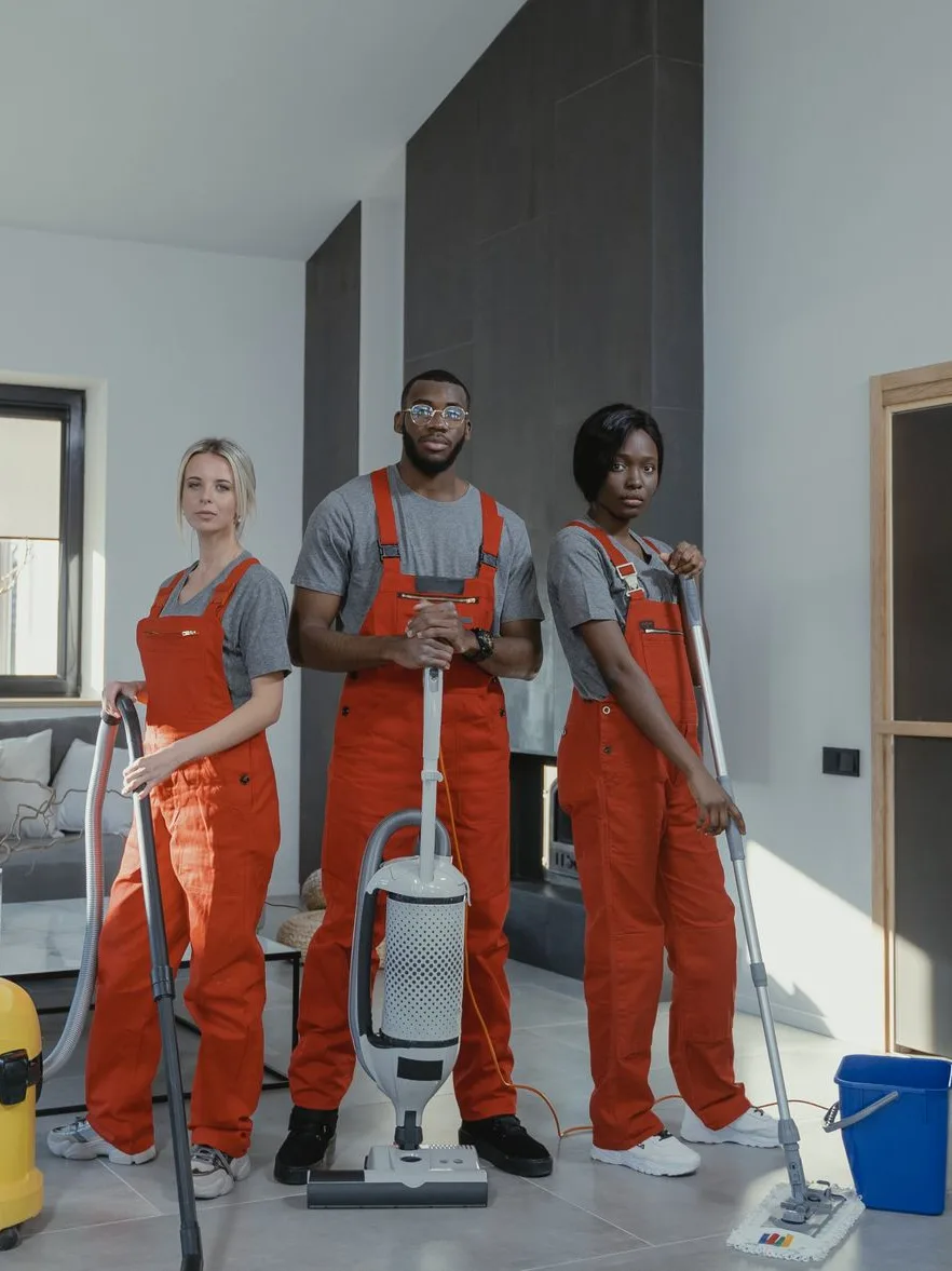 Uniformed cleaning crew with professional equipment